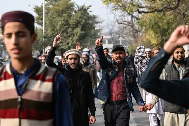 Protesters chant slogans during a protest in Islamabad againstm the Iranian air strike