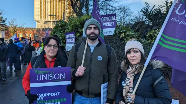 Three Belfast Trust workers striking in Belfast