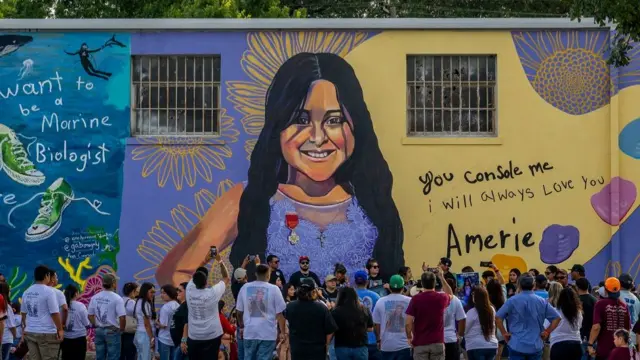 Families and community members visit a mural of 10-year-old Amerie Jo Garza, one of the 19 children and two adults murdered on May 24, 2022 during the mass shooting at Robb Elementary School on May 24, 2023 in Uvalde, Texas. Today marks the 1-year anniversary of the mass shooting at the school. 19 children and two teachers were killed when a gunman entered the school, opening fire on students and faculty.