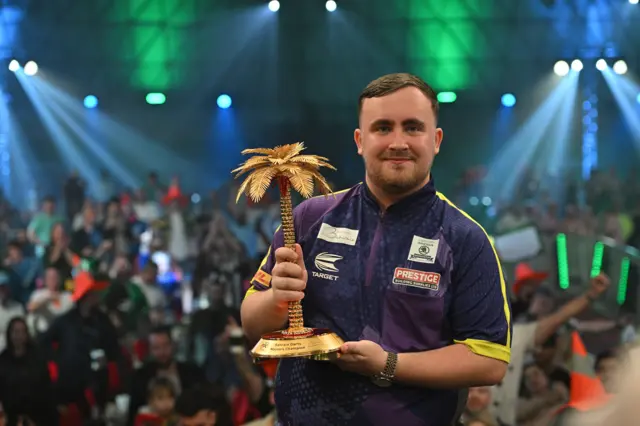 Luke Littler with the Bahrain Masters Trophy