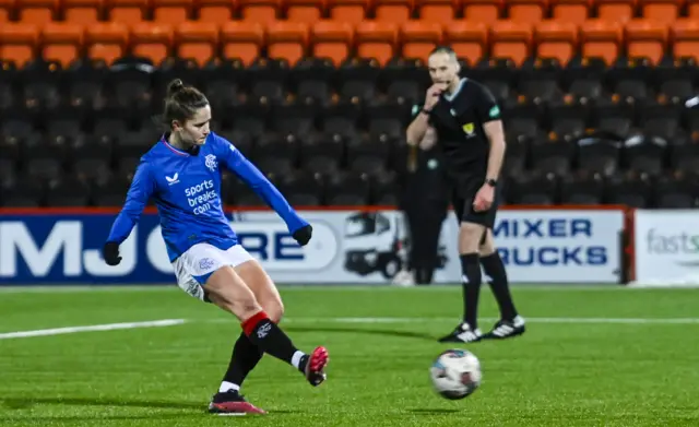 Rio Hardy scores the winning penalty for Rangers against Celtic