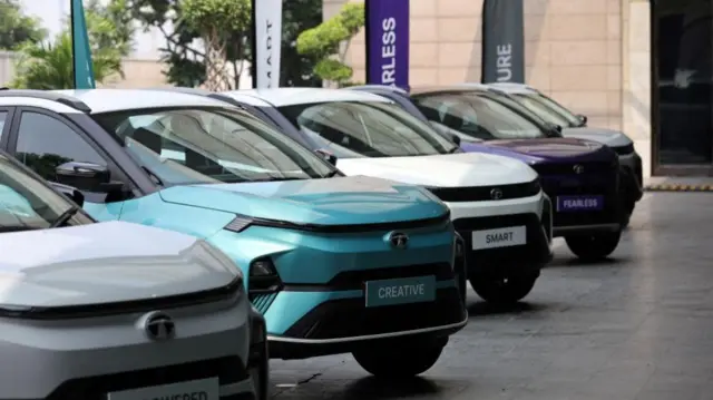 Tata Motors' Nexon and the electric vehicle Nexon.ev are seen parked for display outside a hotel ahead of its launch in New Delhi