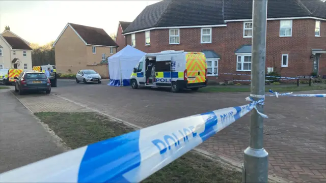 Police scene outside a house on the street