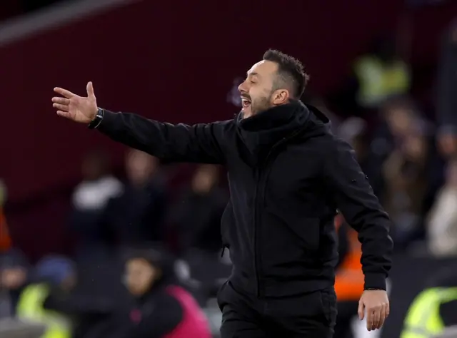De Zerbi shouts and points orders to his players from the touchline.