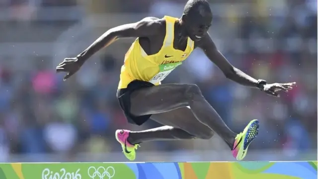 Uganda's Benjamin Kiplagat competes in the Men's 3000m Steeplechase Round 1 during the athletics event at the Rio 2016 Olympic Games at the Olympic Stadium in Rio de Janeiro on August 15, 2016.