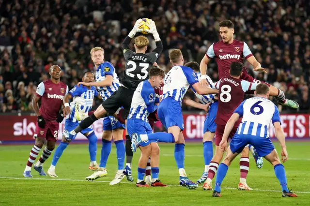 Steele comes out to claim the ball amid a packed penalty area.