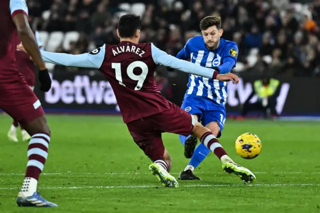 Lallana takes aim from the edge of the box.