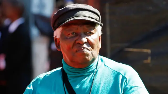 Veteran photojournalist doctor Peter Magubane looks on during the funeral of Albertina Sisulu, a leading light of the former anti-apartheid movement and widow of an early mentor of Nelson Mandela, in Johannesburg, South Africa June 11, 2011