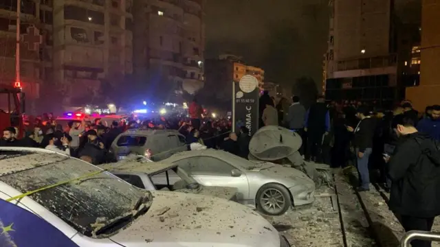 Cars covered in building debris