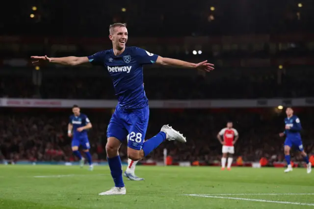 Soucek runs off in celebration after scoring at the Emirates.