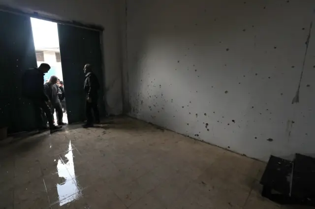 Palestinians look at bullet impacts at the location where four Palestinians were killed during an Israeli army raid at Azoun village Near Qalqilya, West Bank, 2 January 2024