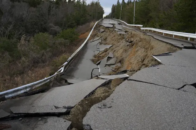 A view of a collapsed road after a strong earthquake near Togi town