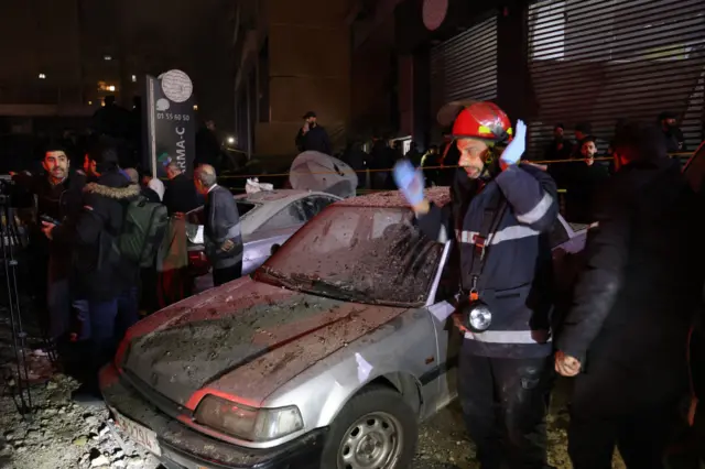 Emergency responder next to a car