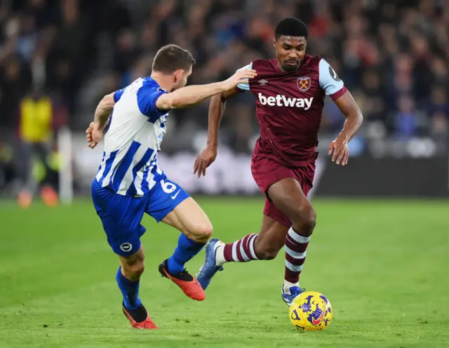 Milner retreats as Johnson breaks forward with the ball.