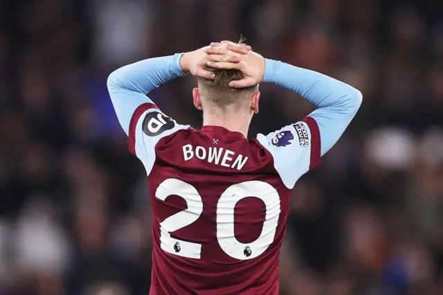 Bowen holds his hands to his head in order to get his breathe back after a long sprint.
