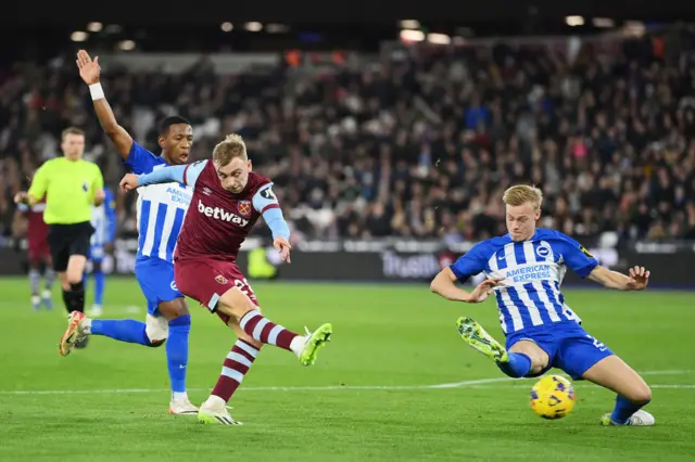 Bowen shoots as Van Hecke tries to dive in the way of the ball.