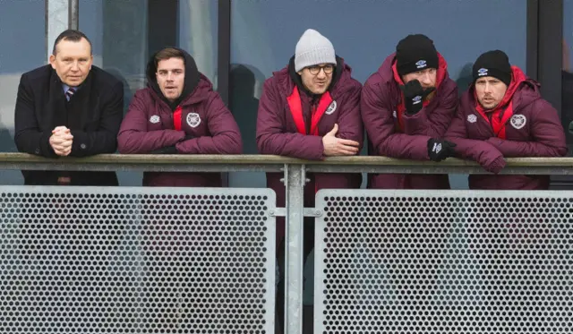 Hearts players watch on