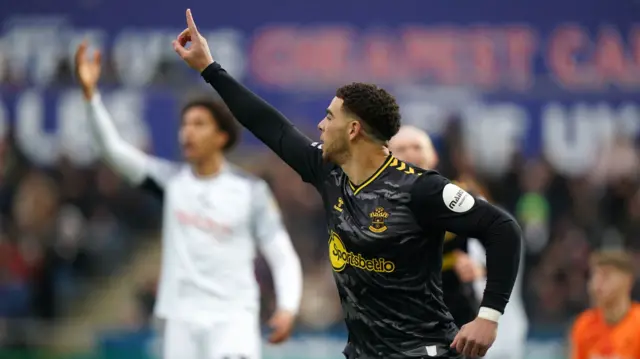 Che Adams celebrates