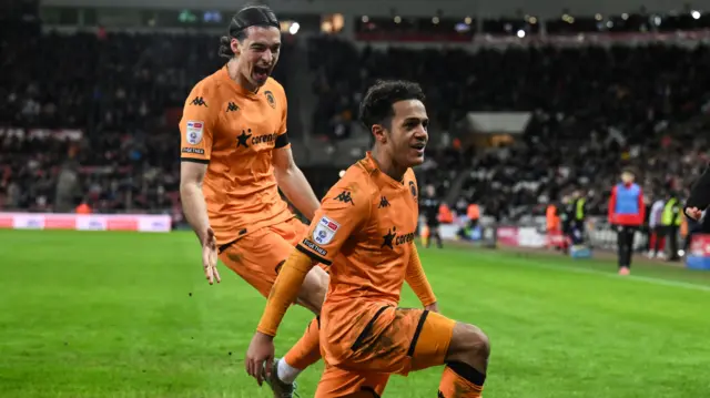 Fabio Carvalho (right) kneels in front of fans in celebration of his goal