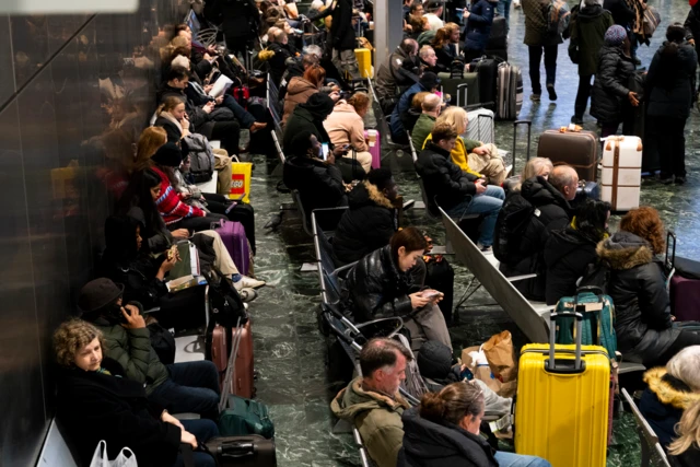 Passengers at Euston station, London.