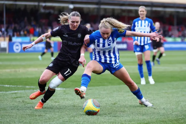 Robinson and Tehstrup battle for the ball in the corner.