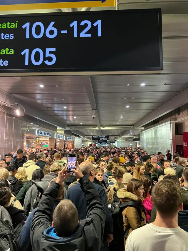 crowds at Dublin Airport due travel disruption (cancellations, delays) caused by Storm Isha