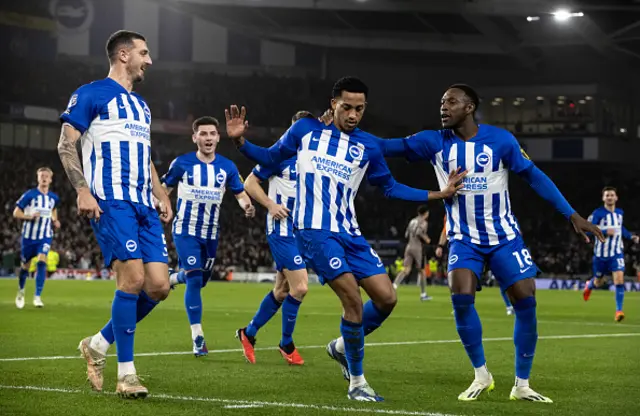 Brighton & Hove Albion's Joao Pedro celebrates scoring with Lewis Dunk and Danny Welbeck