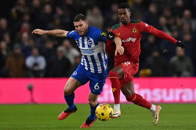 James Milner battles for the ball