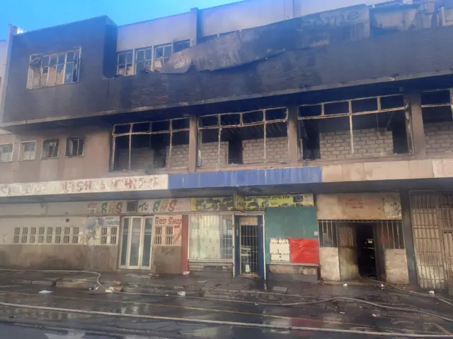 Aftermath after a fire partially burned an illegally occupied building in downtown Johannesburg, South Africa, on 21 January 2024