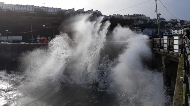 Spray hits a sea wall