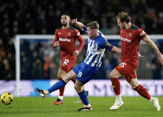 Evan Ferguson on the ball as Dawson runs alongside him