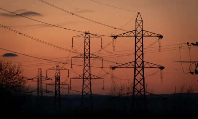 Electrical pylons in a field