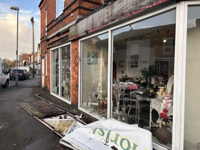 A damaged shop front in Kings Heath