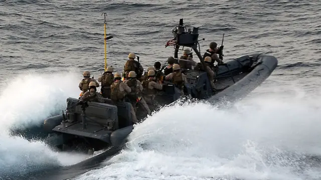 In this handout from the U.S. Navy, U.S. Marine Corps approach the Magellan Star during a boarding and seizure operation to retake the motor vehicle after it was attacked and boarded by pirates September 9, 2010 in the Gulf of Aden.