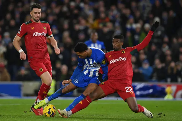 Nelson Semedo blocks Joao Pedro's shot