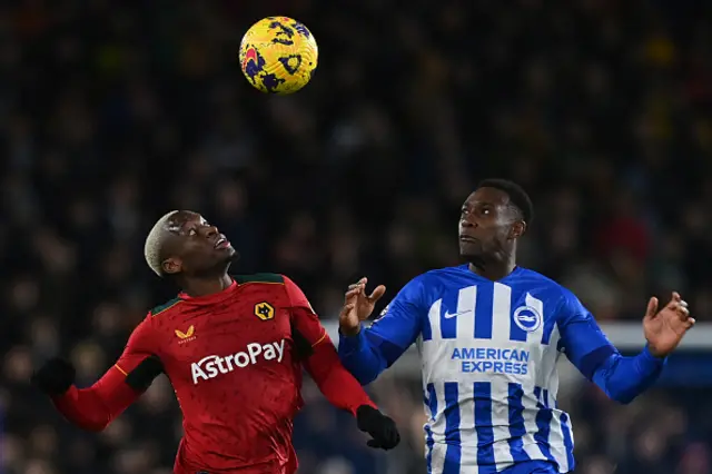 Tote Gomes vies with Brighton's English striker Danny Welbeck