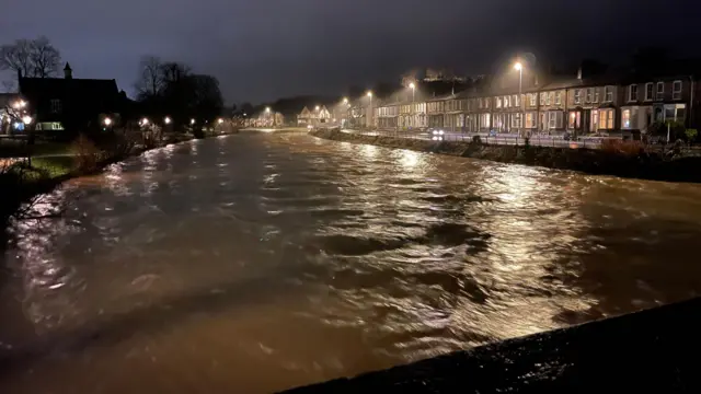 Swollen river full of brown water