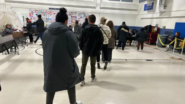 Voters waiting in line at Webster Elementary School in Manchester, New Hampshire