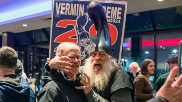 Vermin Supreme (wearing the boot as a hat)