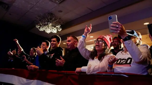 Supporters of Donald Trump attend a rally in Portsmouth, New Hampshire