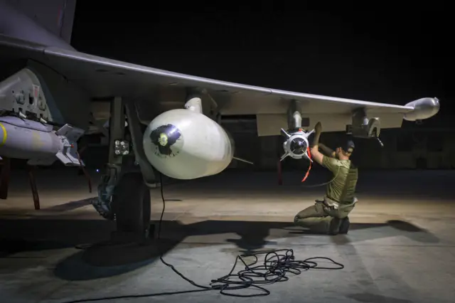 Ministry of Defence of RAF Armourers (Weapon Technicians) preparing a Royal Air Force Typhoon FGR4