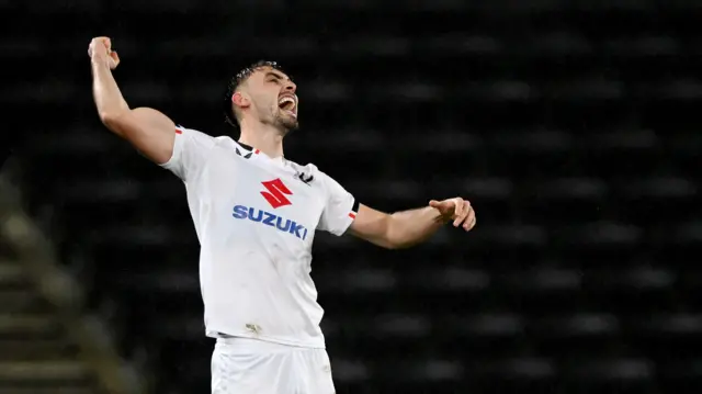 MK Dons celebrate