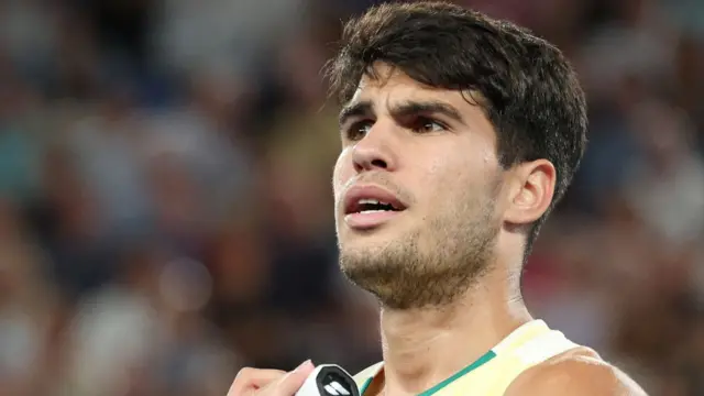 Carlos Alcaraz looks confused during Australian Open quarter-final