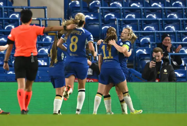 Chelsea celebrate with CUthbert as she forces a goal for them to retake the lead.