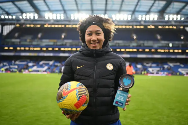 Lauren James holds the match ball for her hat-trick and the Player of the Match award for her display v Man Utd.