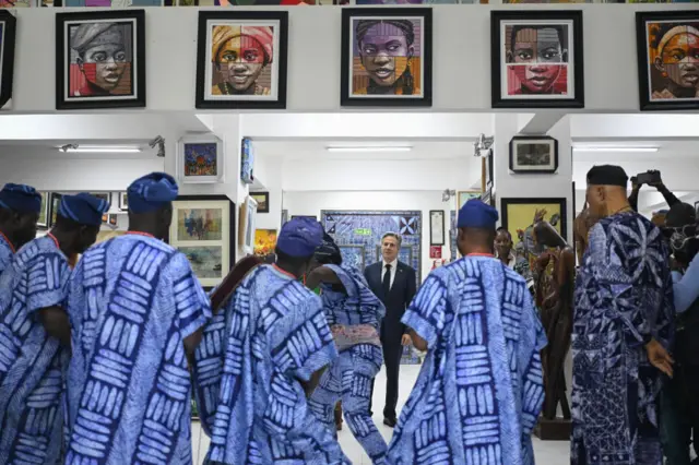 US Secretary of State Antony Blinken (C) looks on as dancers perform at the Nike Art Gallery in Lagos on January 24, 2024.