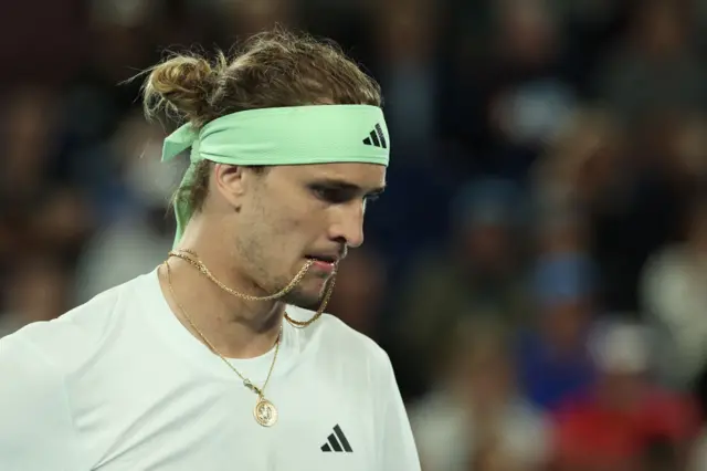 Alexander Zverev looks down at the ground in disappointment