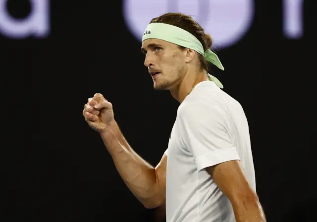 Alexander Zverev clenches his fist looking towards the crowd in celebration