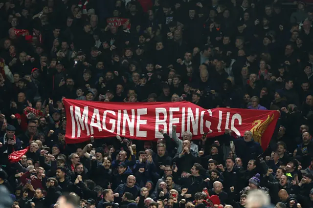 : Liverpool supporters unfurl a banner stating 'Imagine Being Us'