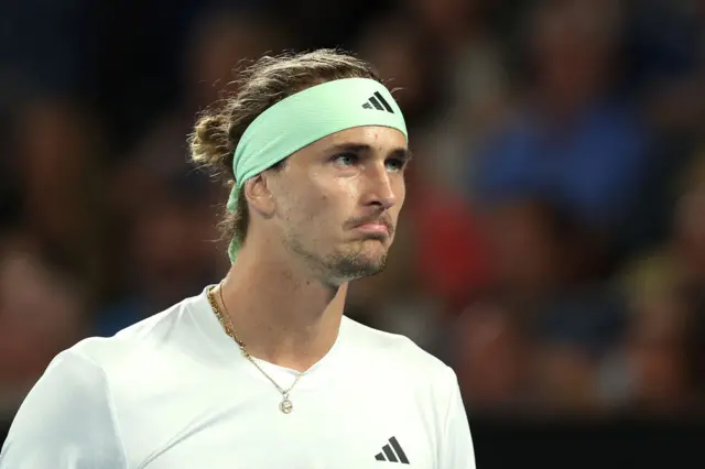 Alexander Zverev looks on